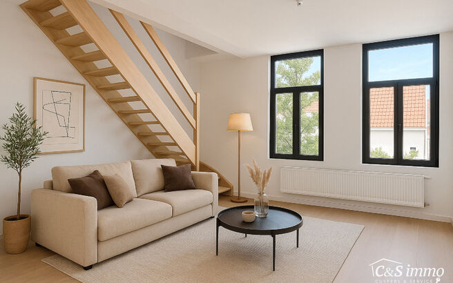 Tip top afgewerkt duplex appartement met 2 slaapkamers.  Dit appartement biedt een perfecte balans tussen comfort en stijl, gelegen in de levendige en vernieuwende wijk Stuivenberg. Bij binnenkomst inkomhal met een apart toilet. De lichtrijke leefruimte o